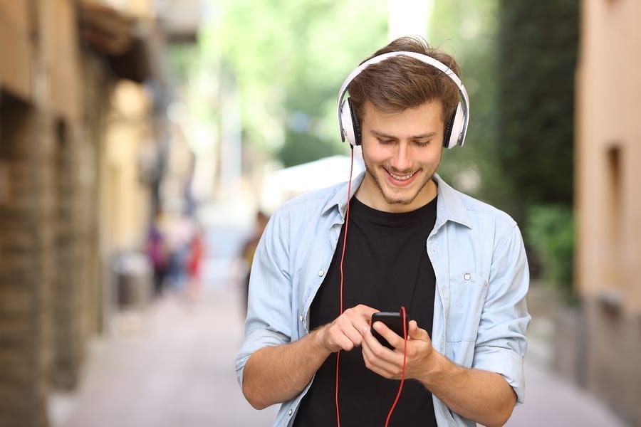 Man listening to subliminal message while outside